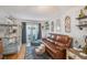 Living area with leather sofa and birdcage at 9209 Seminole Blvd # 209, Seminole, FL 33772