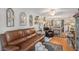 Living room with leather couch and dining area at 9209 Seminole Blvd # 209, Seminole, FL 33772