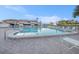 Community pool with plenty of lounge chairs at 9209 Seminole Blvd # 209, Seminole, FL 33772