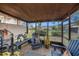 Relaxing screened porch with comfortable seating and sunflower decor at 9209 Seminole Blvd # 209, Seminole, FL 33772