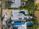 Aerial view showing home, pool, putting green, and landscaping at 1217 De Narvaez Ave, Bradenton, FL 34209