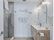 Contemporary bathroom with walk-in shower and floating vanity at 1217 De Narvaez Ave, Bradenton, FL 34209