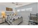 Light and airy bedroom with queen bed and a workspace at 1217 De Narvaez Ave, Bradenton, FL 34209