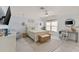 Charming bedroom with queen bed, wicker bench, and a home office at 1217 De Narvaez Ave, Bradenton, FL 34209