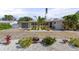 House exterior featuring a large driveway and well-manicured landscaping at 1217 De Narvaez Ave, Bradenton, FL 34209