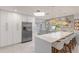 Modern kitchen with white and gray cabinets and a large island at 1217 De Narvaez Ave, Bradenton, FL 34209