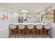 Modern kitchen with white cabinets, quartz countertops, and breakfast bar at 1217 De Narvaez Ave, Bradenton, FL 34209