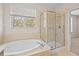 Bathroom featuring garden tub and walk-in shower at 14545 Mirabelle Vista Cir, Tampa, FL 33626