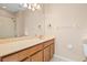 Bathroom with double vanity and large mirror at 14545 Mirabelle Vista Cir, Tampa, FL 33626