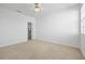 Bedroom with ceiling fan, closet, and neutral carpeting at 14545 Mirabelle Vista Cir, Tampa, FL 33626