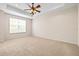 Bright and airy bedroom with large window and ceiling fan at 14545 Mirabelle Vista Cir, Tampa, FL 33626