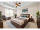 Large bedroom with plush carpet and ceiling fan at 14545 Mirabelle Vista Cir, Tampa, FL 33626