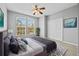 Spacious bedroom with large windows and ceiling fan at 14545 Mirabelle Vista Cir, Tampa, FL 33626
