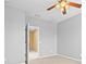 Bright bedroom with ceiling fan and access to another room at 14545 Mirabelle Vista Cir, Tampa, FL 33626
