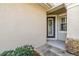 Front entrance with a gray door and stone accents at 14545 Mirabelle Vista Cir, Tampa, FL 33626