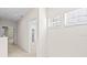 Bright hallway with carpet flooring and access to bedrooms at 14545 Mirabelle Vista Cir, Tampa, FL 33626