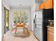 Kitchen nook with wood table and chairs, plus stainless steel appliances at 14545 Mirabelle Vista Cir, Tampa, FL 33626