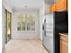 Eat-in kitchen with stainless steel appliances and backyard access at 14545 Mirabelle Vista Cir, Tampa, FL 33626