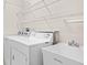 Laundry room with washer, dryer, and utility sink at 14545 Mirabelle Vista Cir, Tampa, FL 33626