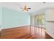 Spacious living room with hardwood floors and access to patio at 14545 Mirabelle Vista Cir, Tampa, FL 33626