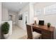 Home office features a desk and two plants at 14545 Mirabelle Vista Cir, Tampa, FL 33626