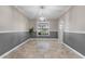 Bright dining room with tile floor and modern light fixture at 16013 Eagle River Way, Tampa, FL 33624