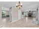 Spacious living room featuring a stone fireplace and tile flooring at 16013 Eagle River Way, Tampa, FL 33624