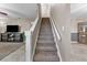 Staircase with carpeted steps and white railings at 16013 Eagle River Way, Tampa, FL 33624