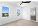 Bright bedroom with wood-look flooring and ceiling fan at 17059 Dolphin Dr, North Redington Beach, FL 33708