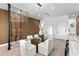 Elegant dining area with glass top table and white cushioned chairs at 17059 Dolphin Dr, North Redington Beach, FL 33708
