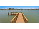 Private wooden dock extending into the calm water at 17059 Dolphin Dr, North Redington Beach, FL 33708