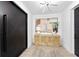 Bright and airy entryway with a modern console table and statement art at 17059 Dolphin Dr, North Redington Beach, FL 33708