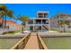 Modern waterfront home with private dock and inviting pool at 17059 Dolphin Dr, North Redington Beach, FL 33708