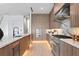 Modern kitchen with wood cabinetry, marble countertops, and high-end appliances at 17059 Dolphin Dr, North Redington Beach, FL 33708