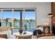 Living area features stunning water views and relaxing seating at 17059 Dolphin Dr, North Redington Beach, FL 33708