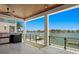Outdoor kitchen with water views; perfect for entertaining at 17059 Dolphin Dr, North Redington Beach, FL 33708