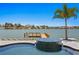 Stunning pool and spa area, featuring a private dock and beautiful water views at 17059 Dolphin Dr, North Redington Beach, FL 33708