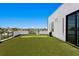 Private rooftop terrace with artificial turf and putting green at 17059 Dolphin Dr, North Redington Beach, FL 33708
