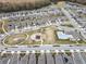 Aerial view of neighborhood amenities including pool and playground at 18079 Ramble On Way, Land O Lakes, FL 34638