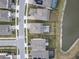 Aerial view of house and neighborhood with lake at 18079 Ramble On Way, Land O Lakes, FL 34638
