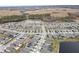 Aerial view of large neighborhood with houses and lake at 18079 Ramble On Way, Land O Lakes, FL 34638