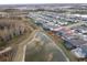 Aerial view of house and backyard near lake at 18079 Ramble On Way, Land O Lakes, FL 34638