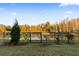 Backyard with fence and pond view at 18079 Ramble On Way, Land O Lakes, FL 34638