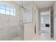 Bathroom with walk-in shower and marble tile at 18079 Ramble On Way, Land O Lakes, FL 34638