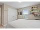Spacious bedroom with double doors leading to a closet at 18079 Ramble On Way, Land O Lakes, FL 34638
