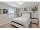 Bright bedroom with plush bedding and built-in shelves at 18079 Ramble On Way, Land O Lakes, FL 34638