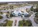 Aerial view of community clubhouse with surrounding landscape at 18079 Ramble On Way, Land O Lakes, FL 34638