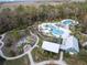 Aerial view of community pool, playground, and clubhouse at 18079 Ramble On Way, Land O Lakes, FL 34638