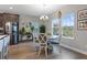 Bright dining area with round table and four chairs, near kitchen at 18079 Ramble On Way, Land O Lakes, FL 34638