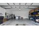 Garage with storage shelving and space for two cars at 18079 Ramble On Way, Land O Lakes, FL 34638